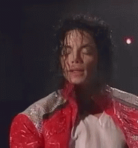 A Close Up Of A Man Wearing A Red Jacket And A White Shirt GIF