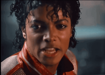 A Close Up Of A Man Wearing A Red Leather Jacket GIF