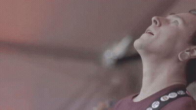 A Close Up Of A Man Wearing A Red Shirt With A Black Strap With Buttons On It That Say " I Love You " GIF