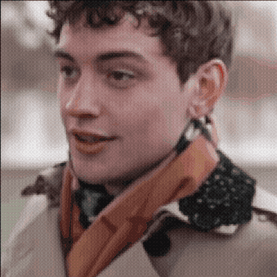 A Close Up Of A Man Wearing A Scarf GIF