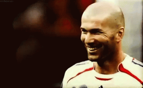 A Close Up Of A Man Wearing A Soccer Jersey Smiling GIF