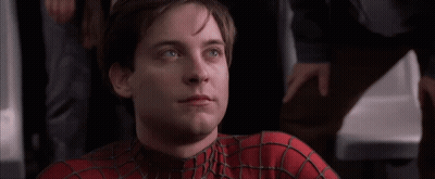 A Close Up Of A Man Wearing A Spiderman Costume GIF