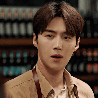 A Close Up Of A Man Wearing A Tan Shirt GIF