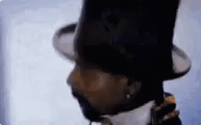 A Close Up Of A Man Wearing A Top Hat And A Beard . GIF