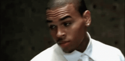 A Close Up Of A Man Wearing A White Shirt And Tie GIF