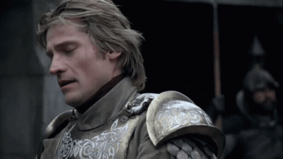 A Close Up Of A Man Wearing Armor With A Dragon On The Shoulder GIF