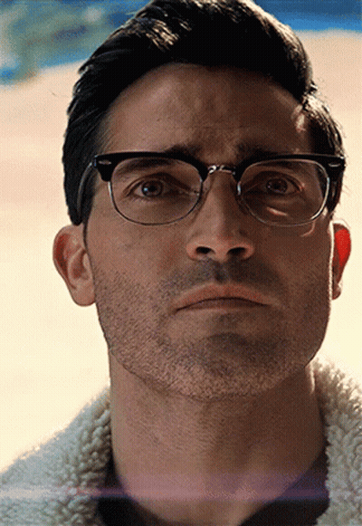 A Close Up Of A Man Wearing Glasses And A Beard GIF