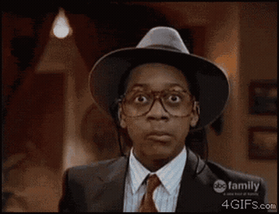 A Close Up Of A Man Wearing Glasses And A Hat With Abc Family On The Bottom GIF