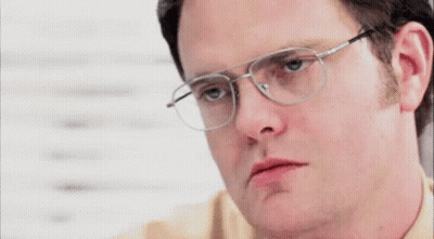 A Close Up Of A Man Wearing Glasses And Making A Funny Face GIF
