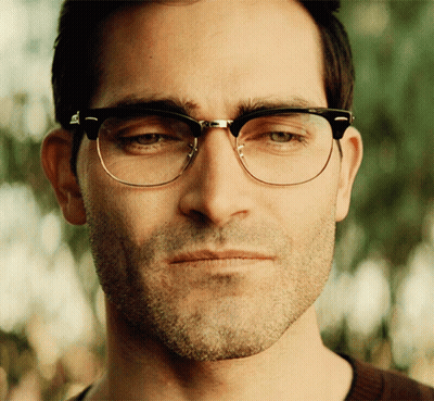 A Close Up Of A Man Wearing Glasses Looking At The Camera GIF