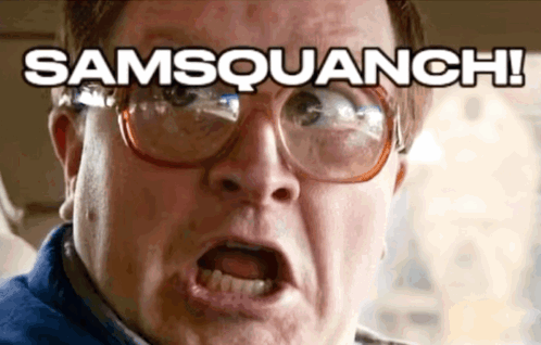 A Close Up Of A Man Wearing Glasses With The Words Samsquanch Above His Head GIF