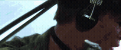 A Close Up Of A Man Wearing Headphones And A Hat With The Word Who On It GIF