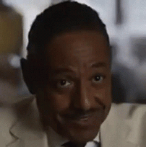 A Close Up Of A Man Wearing Headphones And A Suit And Tie . GIF