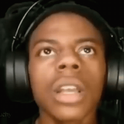 A Close Up Of A Man Wearing Headphones Making A Funny Face . GIF