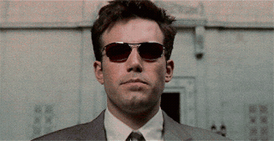 A Close Up Of A Man Wearing Red Sunglasses . GIF