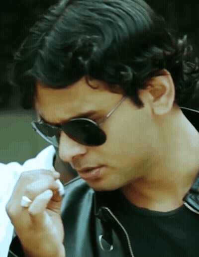 a close up of a man wearing sunglasses and a black jacket