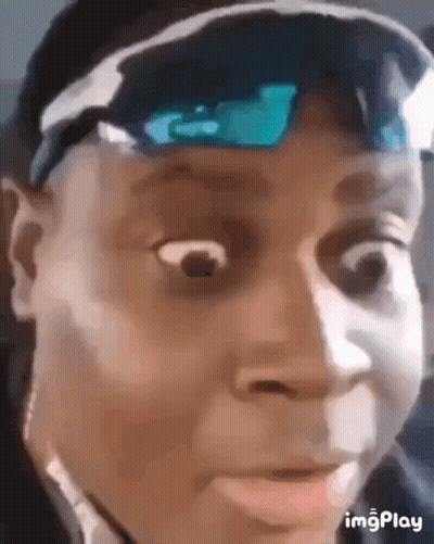 A Close Up Of A Man Wearing Sunglasses And A Hat Making A Funny Face . GIF