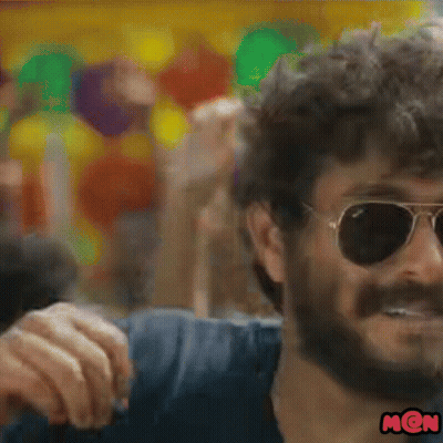 A Close Up Of A Man Wearing Sunglasses And A Mon Sticker GIF