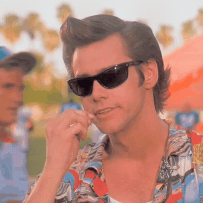 A Close Up Of A Man Wearing Sunglasses And A Shirt GIF