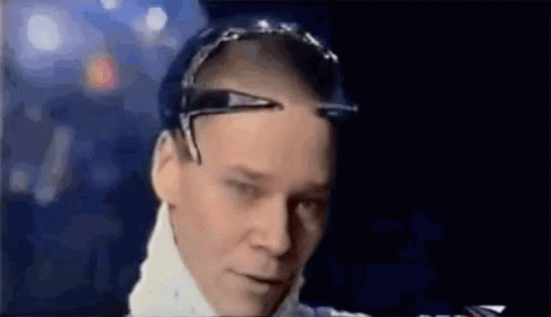 A Close Up Of A Man Wearing Sunglasses And A White Shirt . GIF