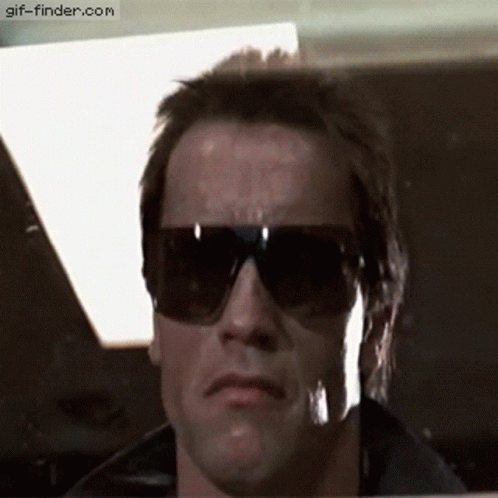 A Close Up Of A Man Wearing Sunglasses With The Website Gif-Finder.com In The Lower Right Corner GIF