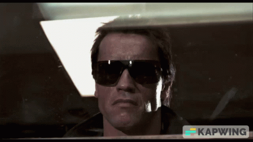 A Close Up Of A Man Wearing Sunglasses With The Word Kapwing On The Bottom Right GIF