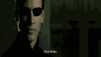 A Close Up Of A Man Wearing Sunglasses With The Words Hiya Fellas Written Below Him GIF