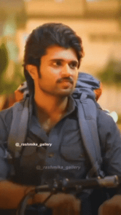 A Close Up Of A Man With A Backpack And The Name Rashmika Gallery On The Bottom Right GIF