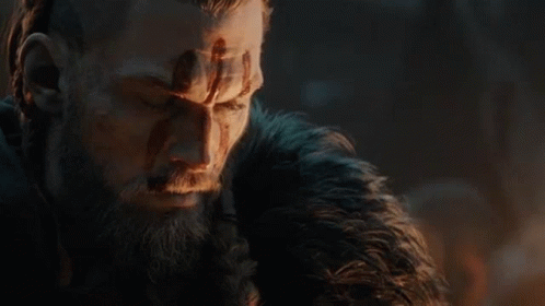 A Close Up Of A Man With A Beard And A Fur Coat . GIF