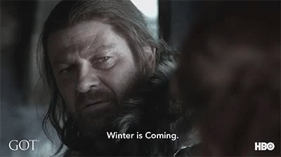 A Close Up Of A Man With A Beard And Long Hair Looking At Another Man . GIF
