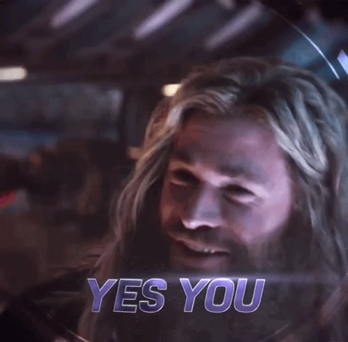 A Close Up Of A Man With A Beard And Long Hair Smiling GIF