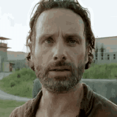 A Close Up Of A Man With A Beard And Long Hair . GIF