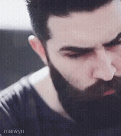 A Close Up Of A Man With A Beard And Mustache . GIF