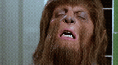 A Close Up Of A Man With A Beard And Pink Lipstick On His Face . GIF