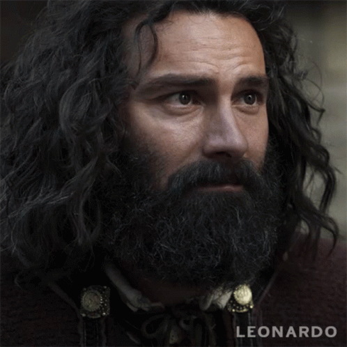 A Close Up Of A Man With A Beard And The Name Leonardo On The Bottom GIF