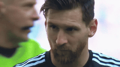 A Close Up Of A Man With A Beard Wearing A Black Adidas Shirt GIF
