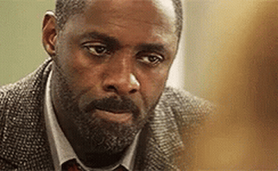 A Close Up Of A Man With A Beard Wearing A Suit And Tie GIF