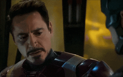 A Close Up Of A Man With A Beard Wearing A Superhero Suit GIF