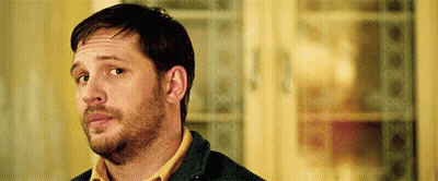 A Close Up Of A Man With A Beard Wearing A Yellow Shirt . GIF