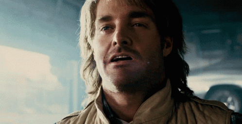 A Close Up Of A Man With A Mullet GIF