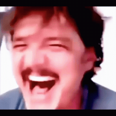 A Close Up Of A Man With A Mustache Laughing With His Eyes Closed . GIF