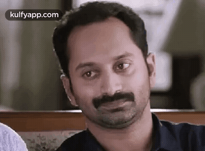 A Close Up Of A Man With A Mustache Making A Funny Face . GIF
