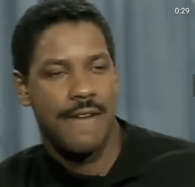 A Close Up Of A Man With A Mustache Making A Funny Face GIF