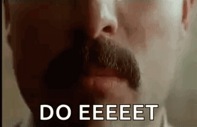 A Close Up Of A Man With A Mustache Saying `` Do Eeeet '' . GIF
