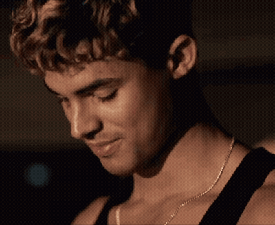 A Close Up Of A Man With A Tattoo On His Face GIF