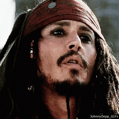 A Close Up Of A Man With Dreadlocks And A Scarf Around His Head GIF