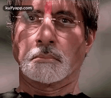 A Close Up Of A Man With Glasses And A Beard GIF