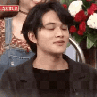 A Close Up Of A Man With His Eyes Closed . GIF