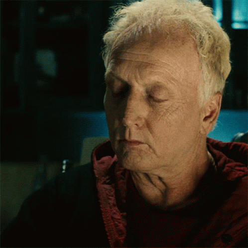 A Close Up Of A Man With His Eyes Closed GIF