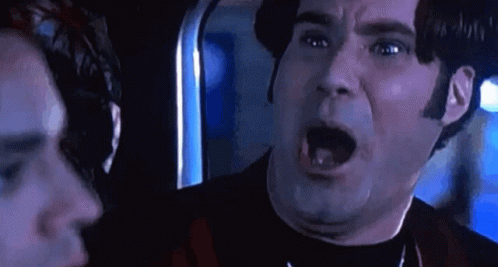 A Close Up Of A Man With His Mouth Open . GIF
